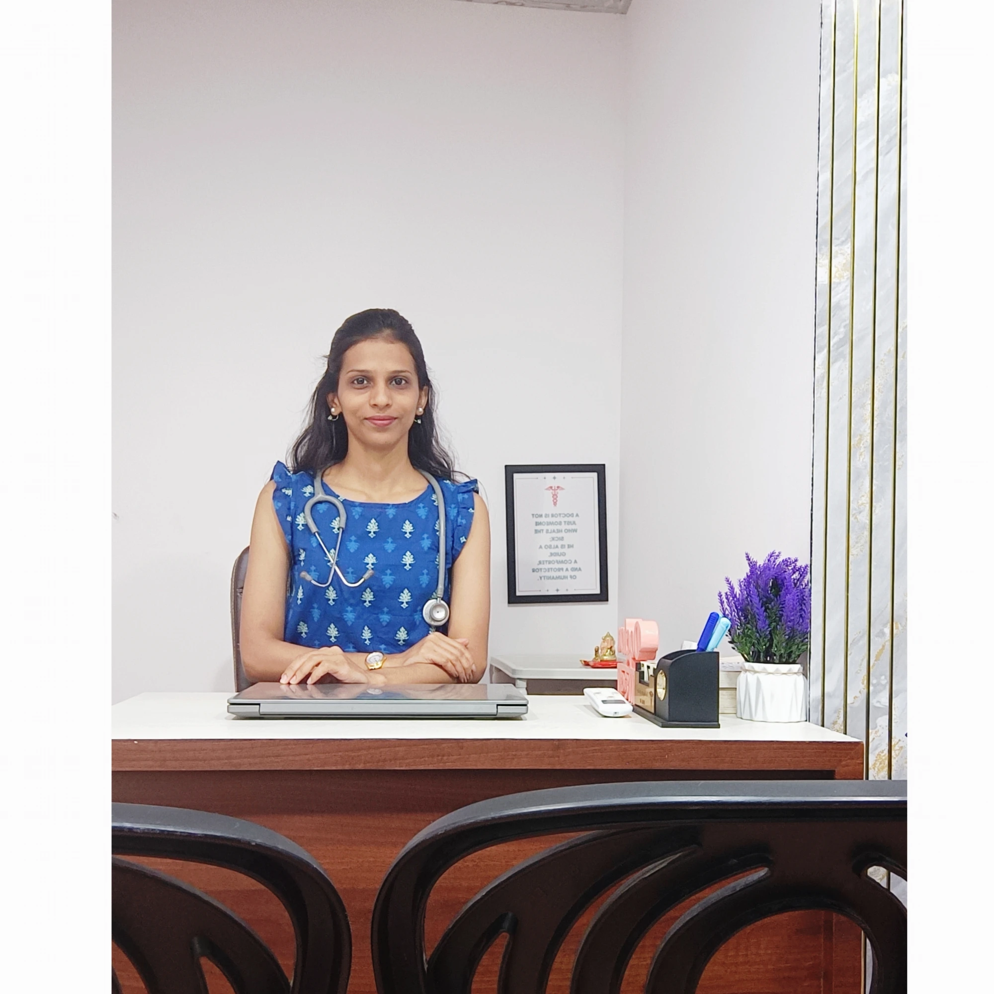 Dr. Mugdha Adhikari at her clinic desk