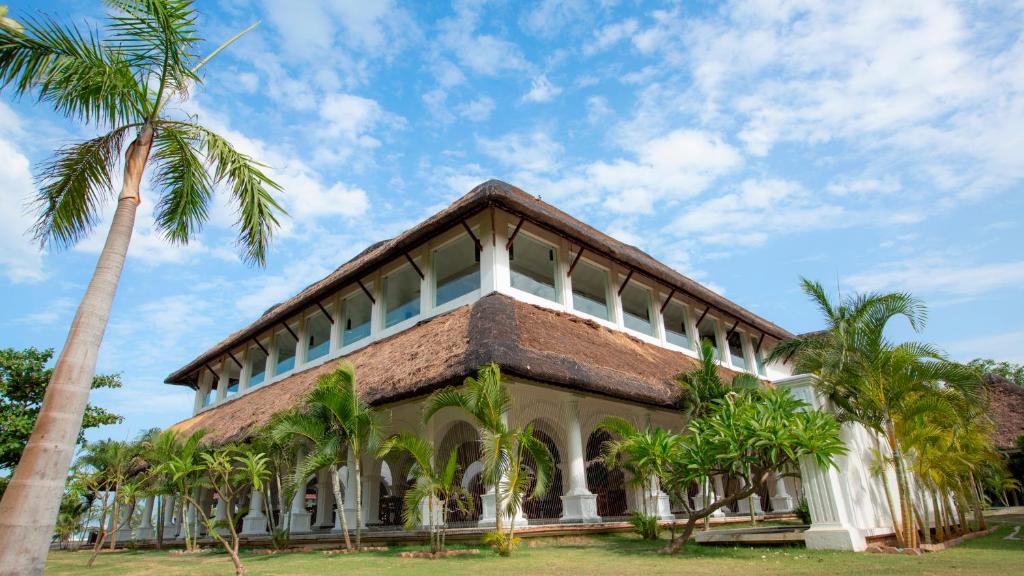The main block, among the palms
