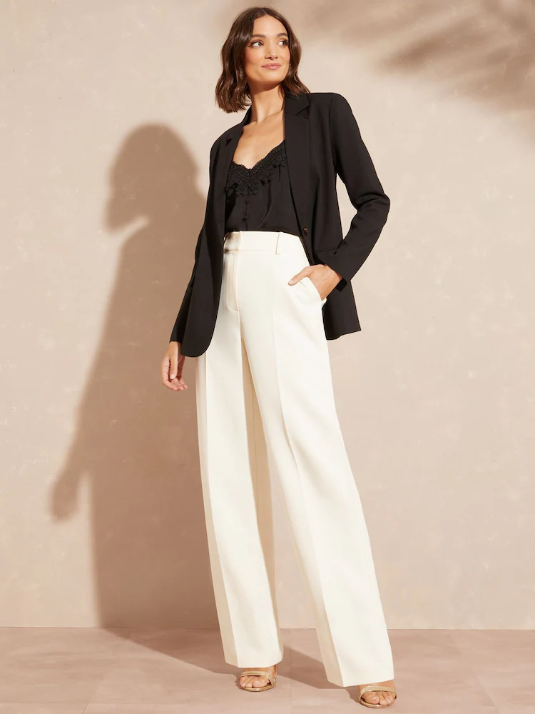 product Wide white trousers from Next with black blazer
