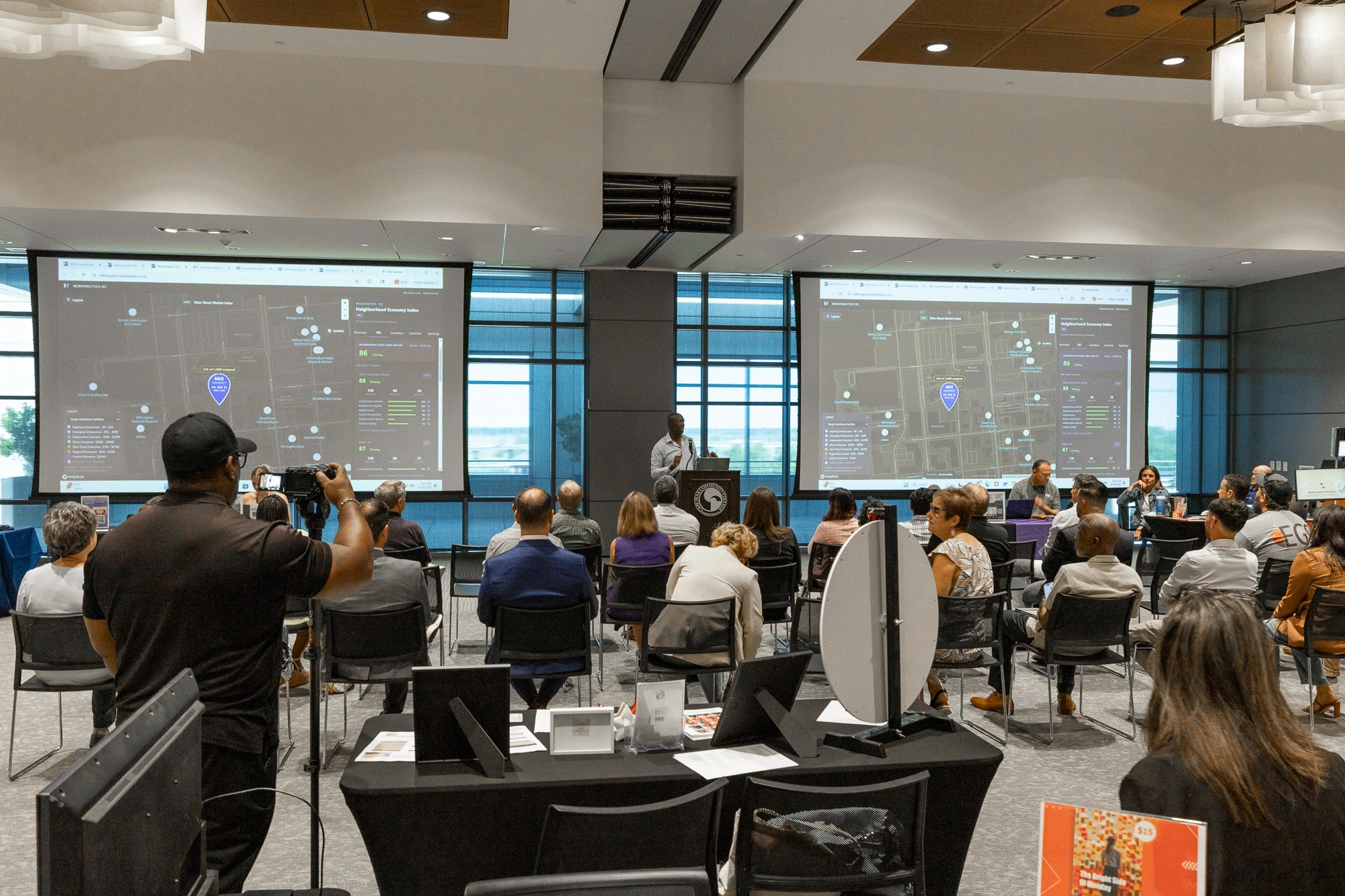 OS live on twin screens · Neighborhood Economy Index