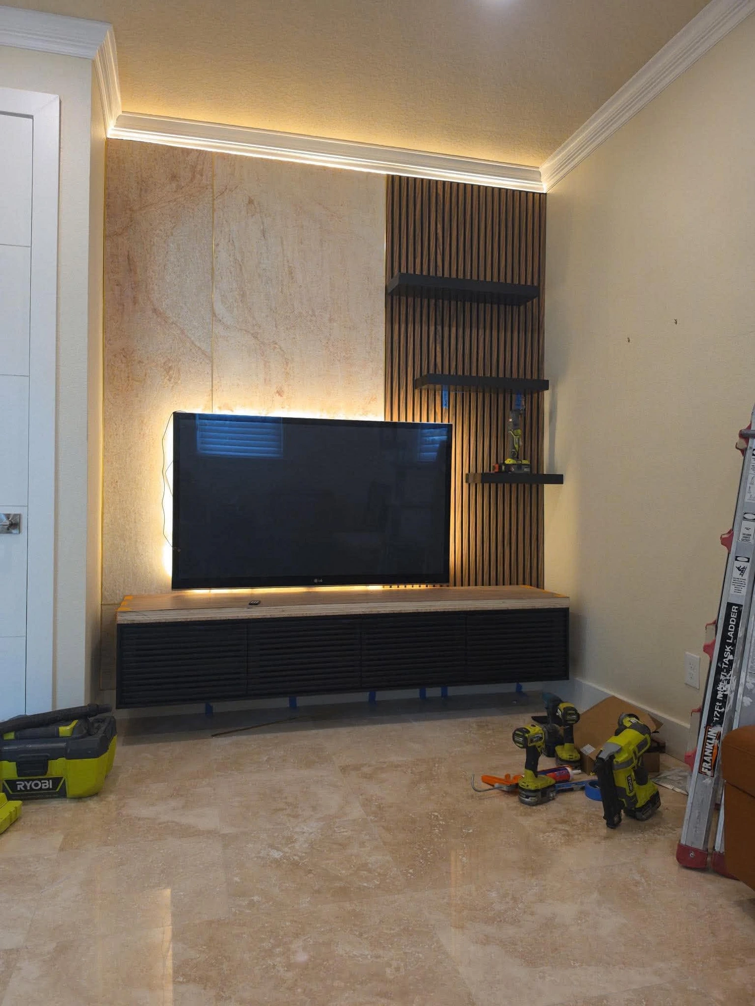 Stone Veneer & Walnut Slat Media Wall — installed by Swift Luxury Walls in Riverview