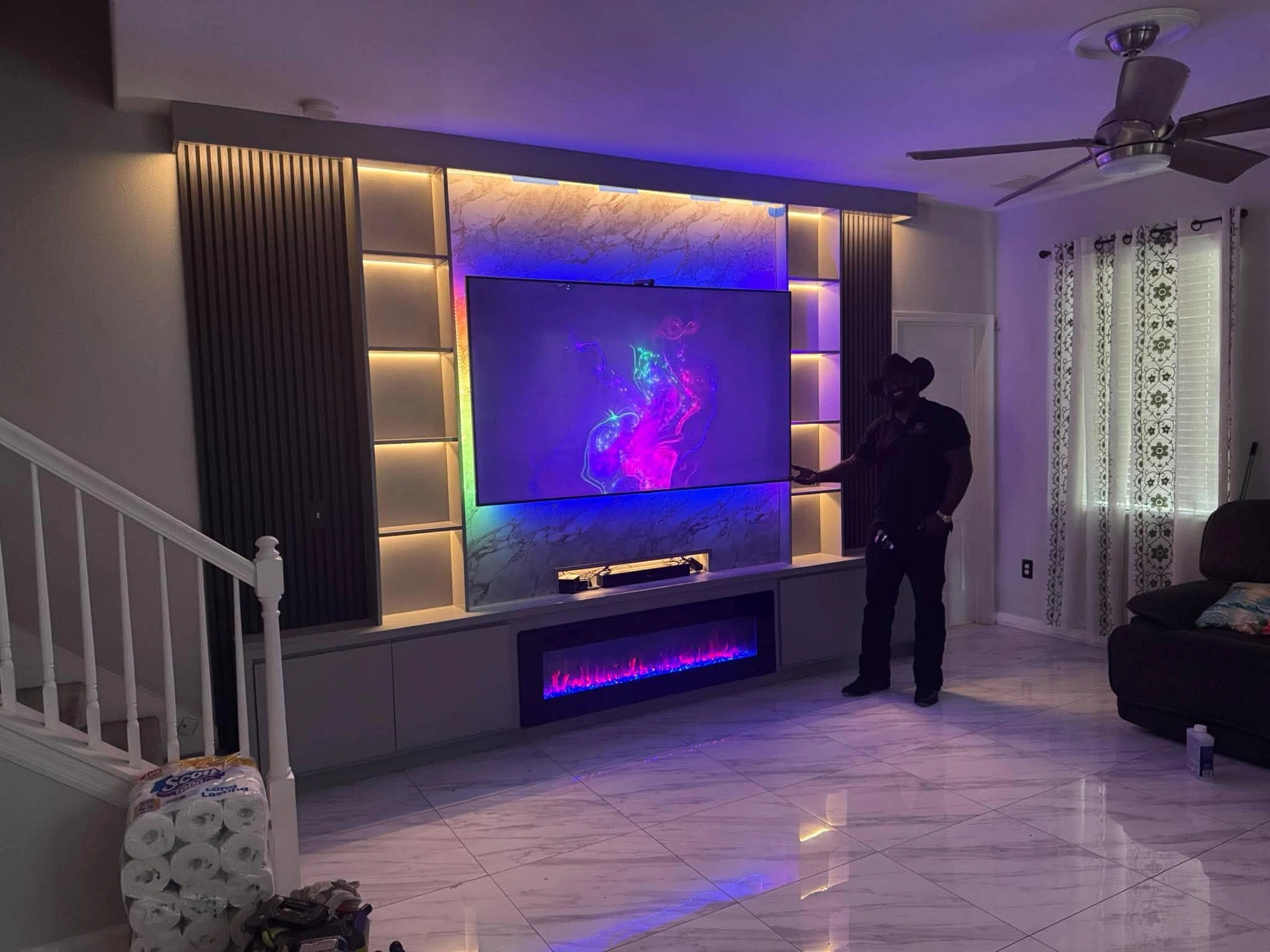 Color-Changing Media Wall + Fireplace — installed by Swift Luxury Walls in Brandon