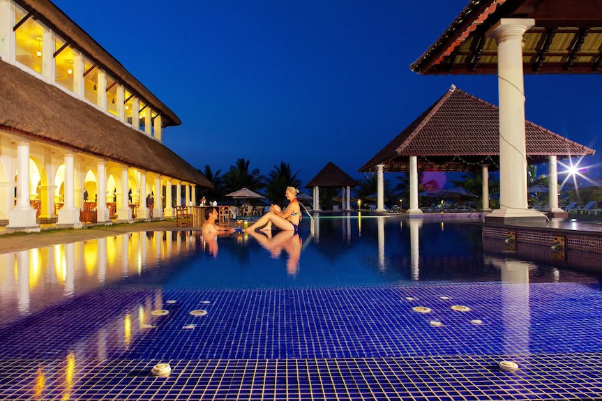 Le Pondy Beach Resort pool at dusk