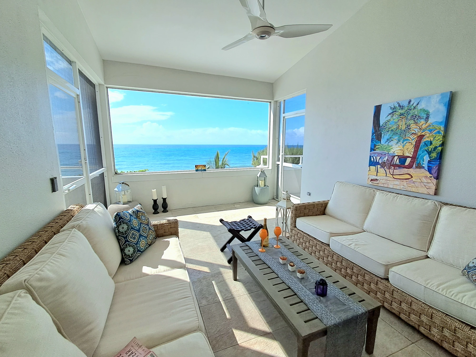 Oceanfront living room with panoramic Caribbean view