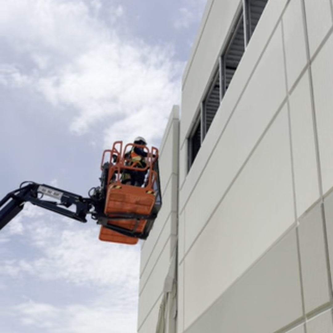 Highwall Lift-Hanger - boom lift operator completing panel placement