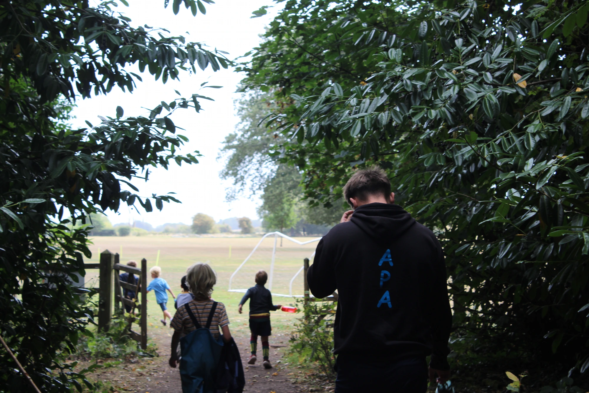 Heading out to the playing field with a coach on a camp day